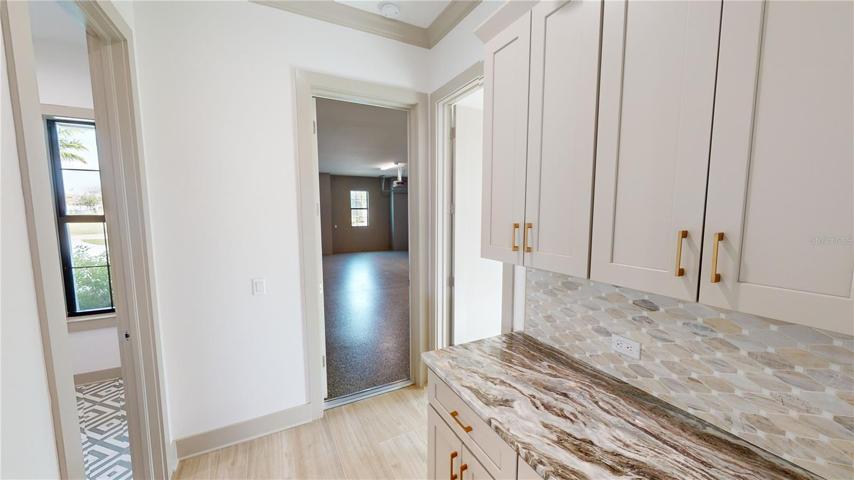 Garage foyer, laundry room and ensuite guest room