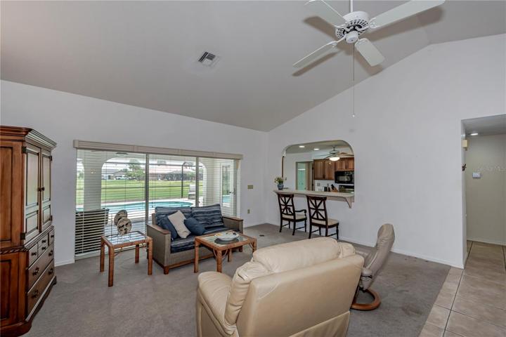 living room with pocket slider access to pool