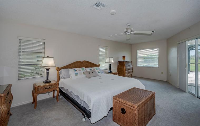 turnkey furnished master bedroom with pool access plus extra seating area