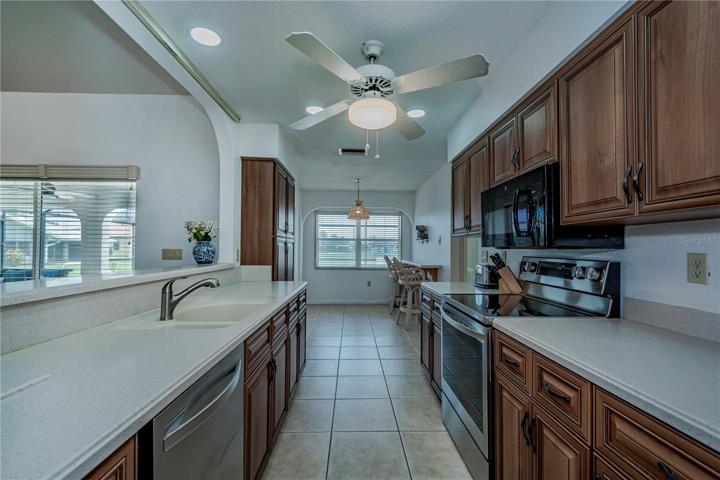 nicely remodeled kitchen with corian, stainless appliances