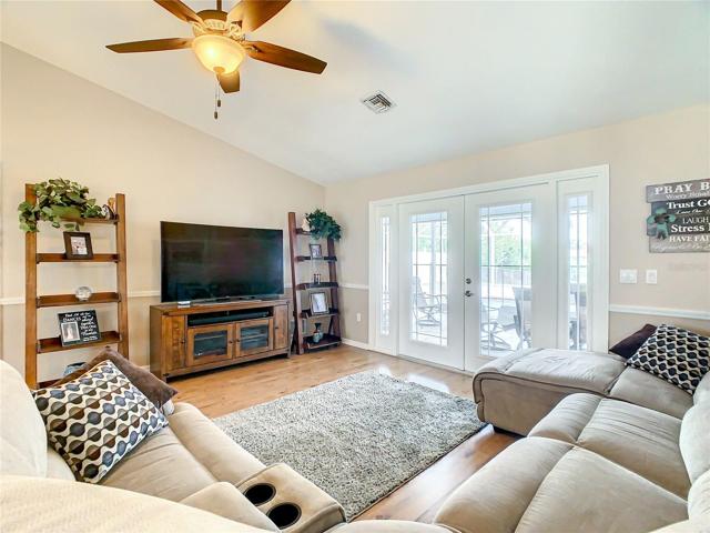 Great Room View showing the French Hurricane Impact Doors and Side Windows