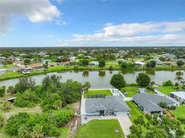 Aerial View showing the large lake behind the home and surrounding neighborhood.