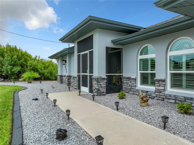 Beautiful walk way to the entry lined with solar lighting and contrasting stone. Very Clean and Nice!