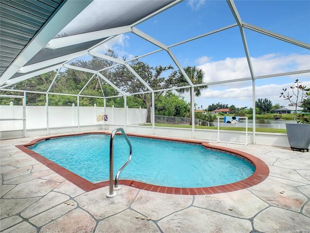 Larger than most similar homes. Pool is Heated and is approximately 31 ft. long and 14 ft wide at the widest point and approximately 7 or 8 feet deep in the center.