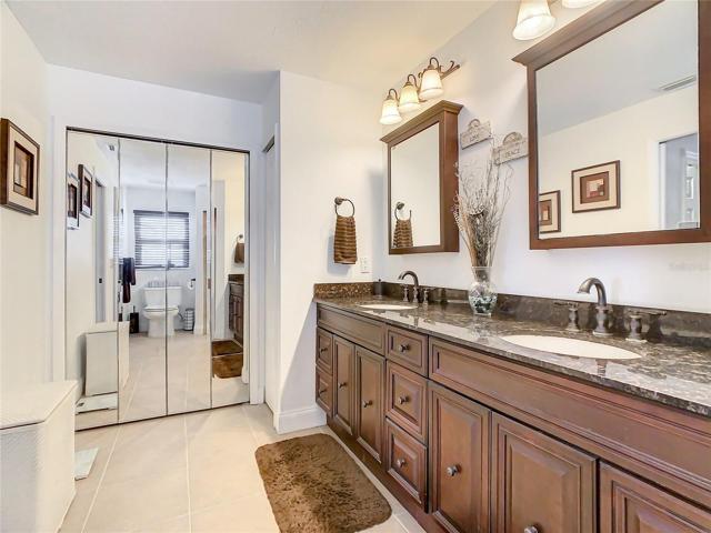 Mirrored Doors to a LARGE Wrap Around Walk in Closet!