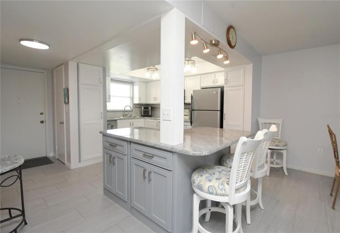 It features custom made cabinets with soft closing hinges and a convenient lazy Suzan.