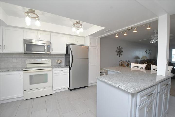Kitchen comes with beautiful tile floor.