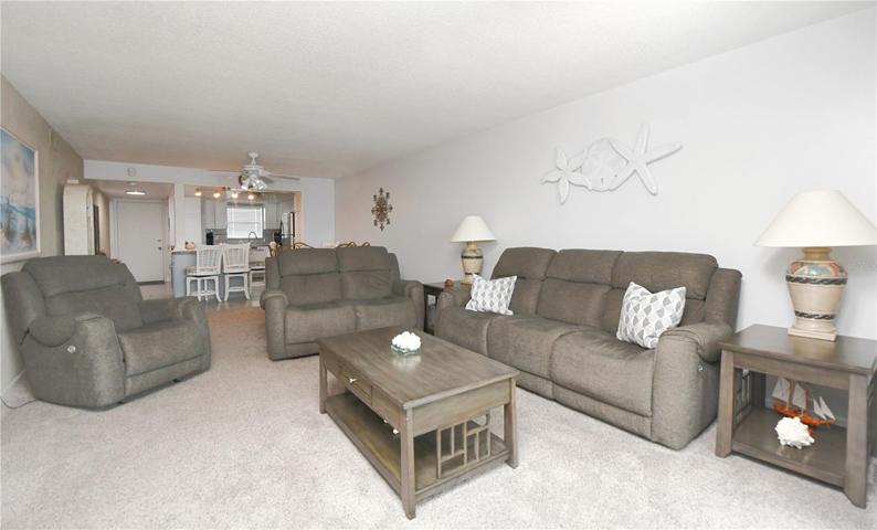 Luxurious carpeting throughout adds a touch of elegance and creates a warm and inviting atmosphere.
