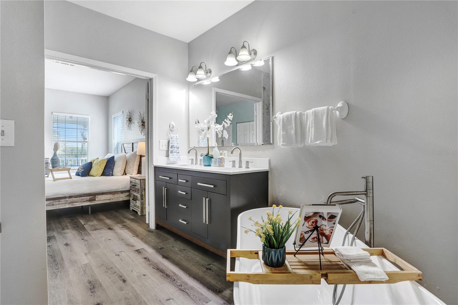 The master bathroom has a beautiful walk-in shower, a free-standing tub, and a big walk-in closet!