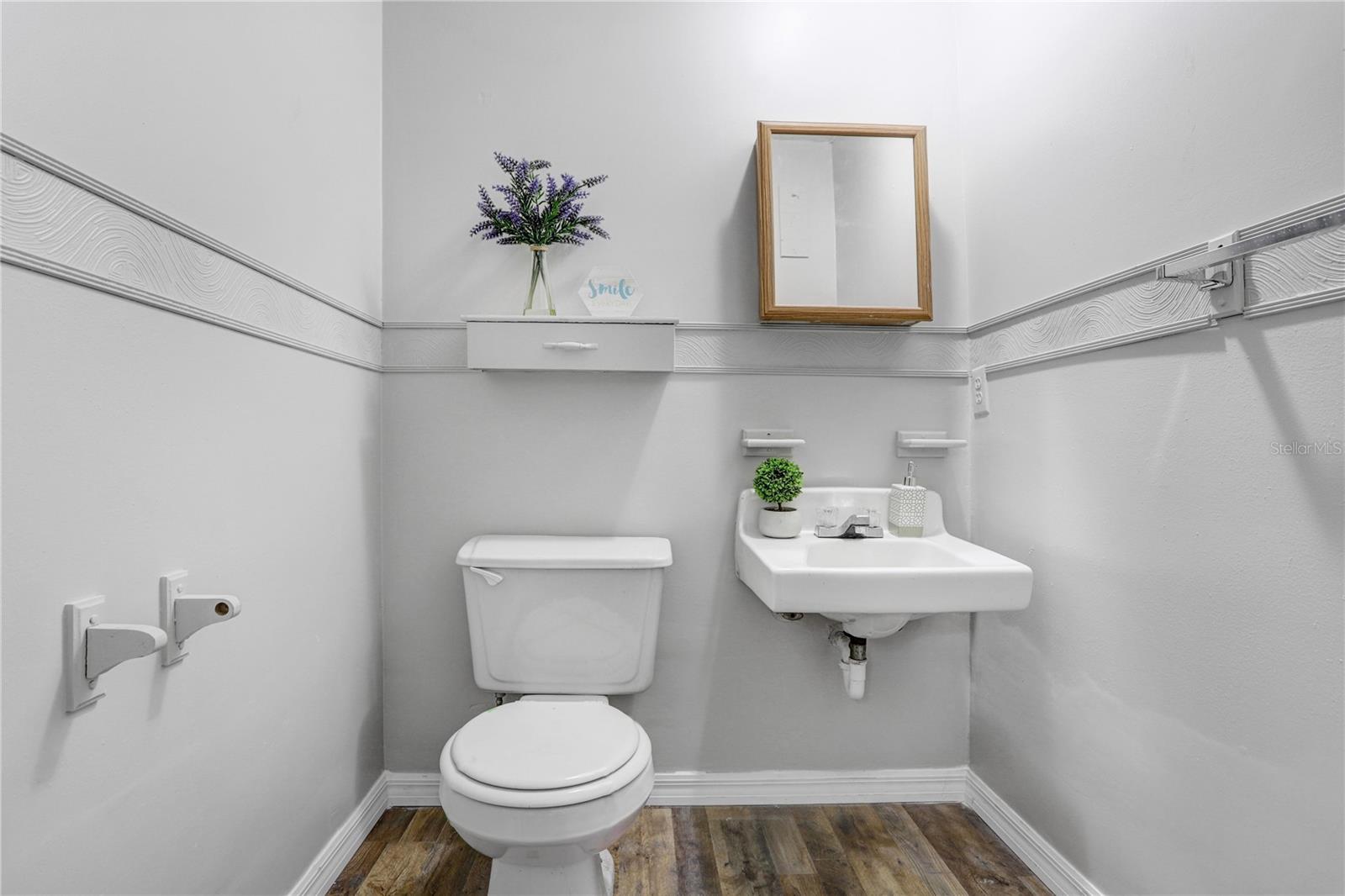 The half bathroom in detached office.  Brand new toilet.