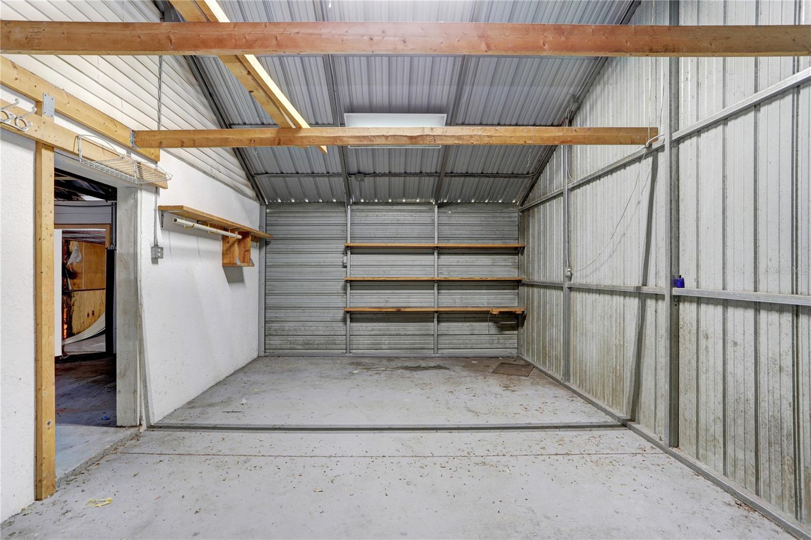 This is the one-car garage portion of the garage.  The shelving will stay.