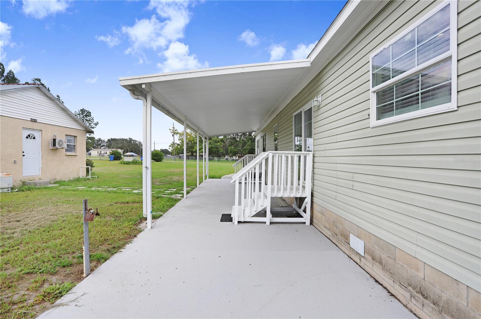 The back patio is large and mostly covered.