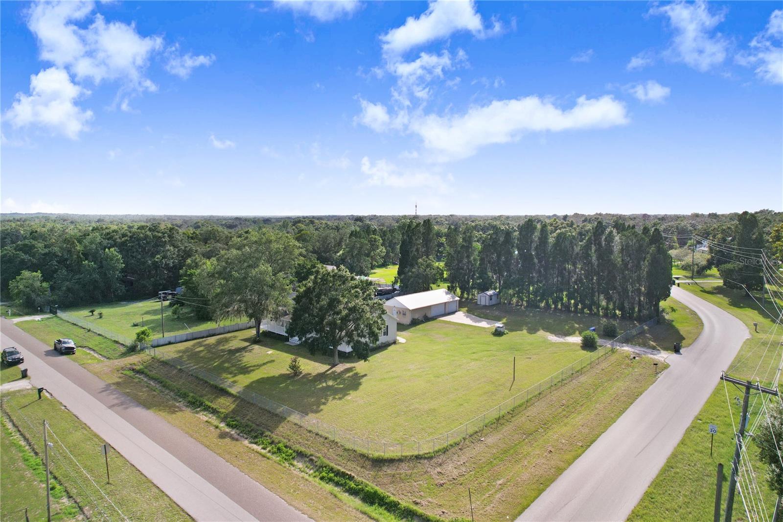 There are two access points to the property.  One is off Tevalo, and one is off Hideaway. The Hideaway access is a rolling gate and leads to the garage.