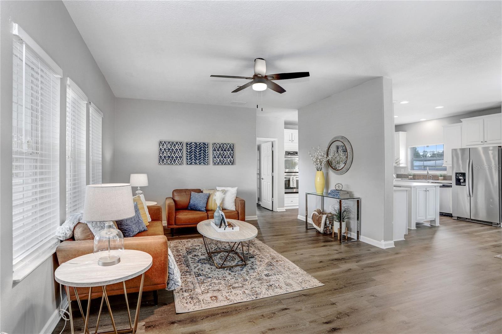 Upon entry into the home, you're greeted with a light and bright feeling of openness!  The Luxury Vinyl Plank floors are everywhere in the home!  And it's waterproof!!!