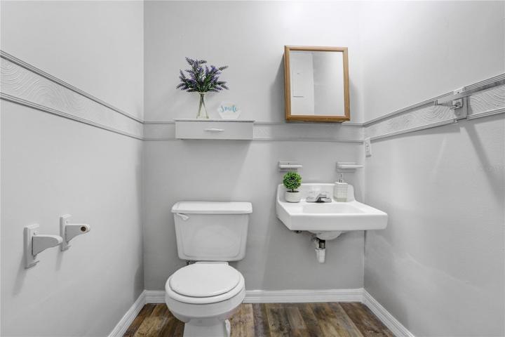 The half bathroom in detached office.  Brand new toilet.