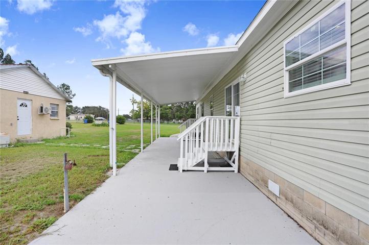 The back patio is large and mostly covered.
