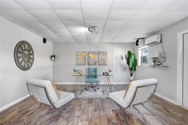 Detached office space with half bathroom.