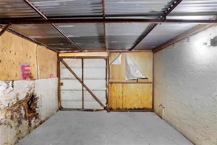 This is an attached storage room.  It's accessible through a door in the garage and also from the exterior.