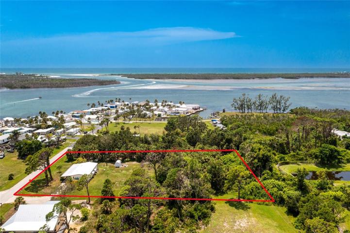 This property could easily be subdivided into other building lots. With a home on pilings, you would probably have a bay view!