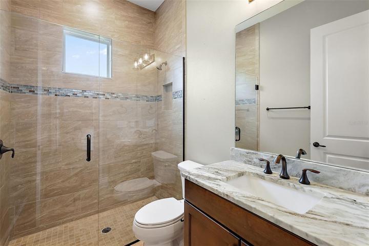 Guest bathroom w/tiled walk in shower