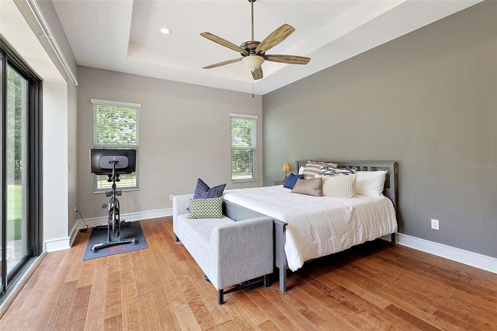 Master bedroom w/tray ceiling & engineered hardwood flooring