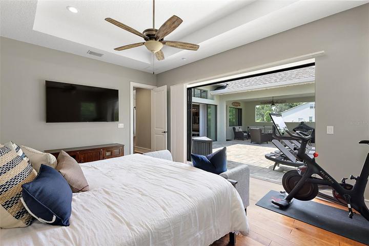 Master bedroom w/stackable sliders to back patio