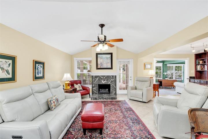Family room with vaulted ceiling & electric fireplace