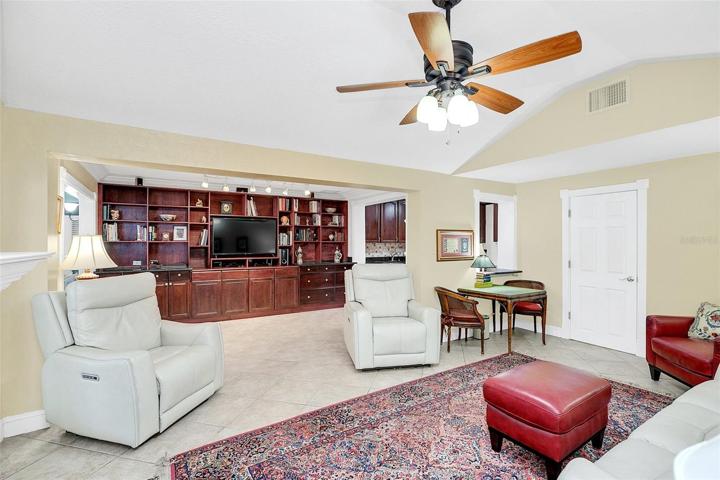 Family room to open den with custom built-ins