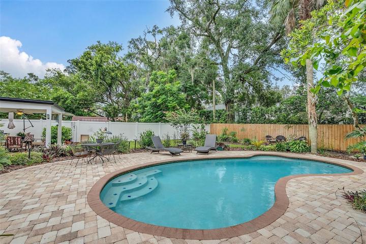 Pool inside fully fenced backyard