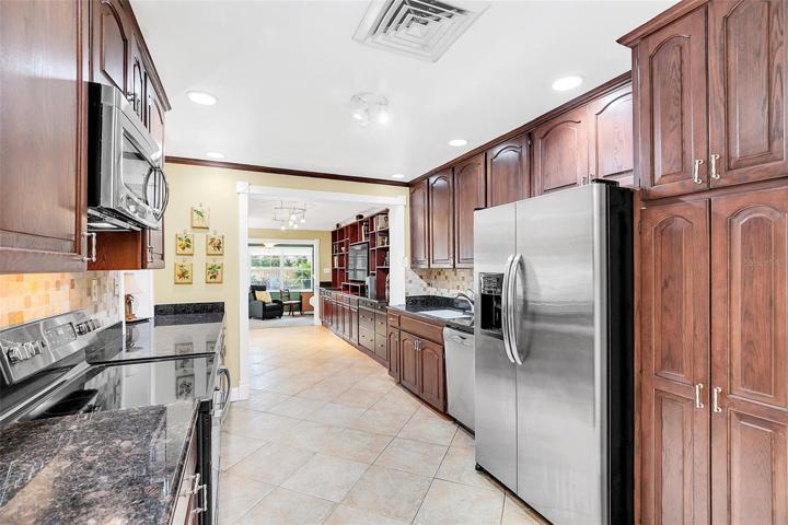 Kitchen with lots of wood cabinets & storage