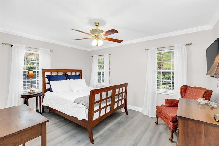 Bedroom 3 with crown molding and laminate floors