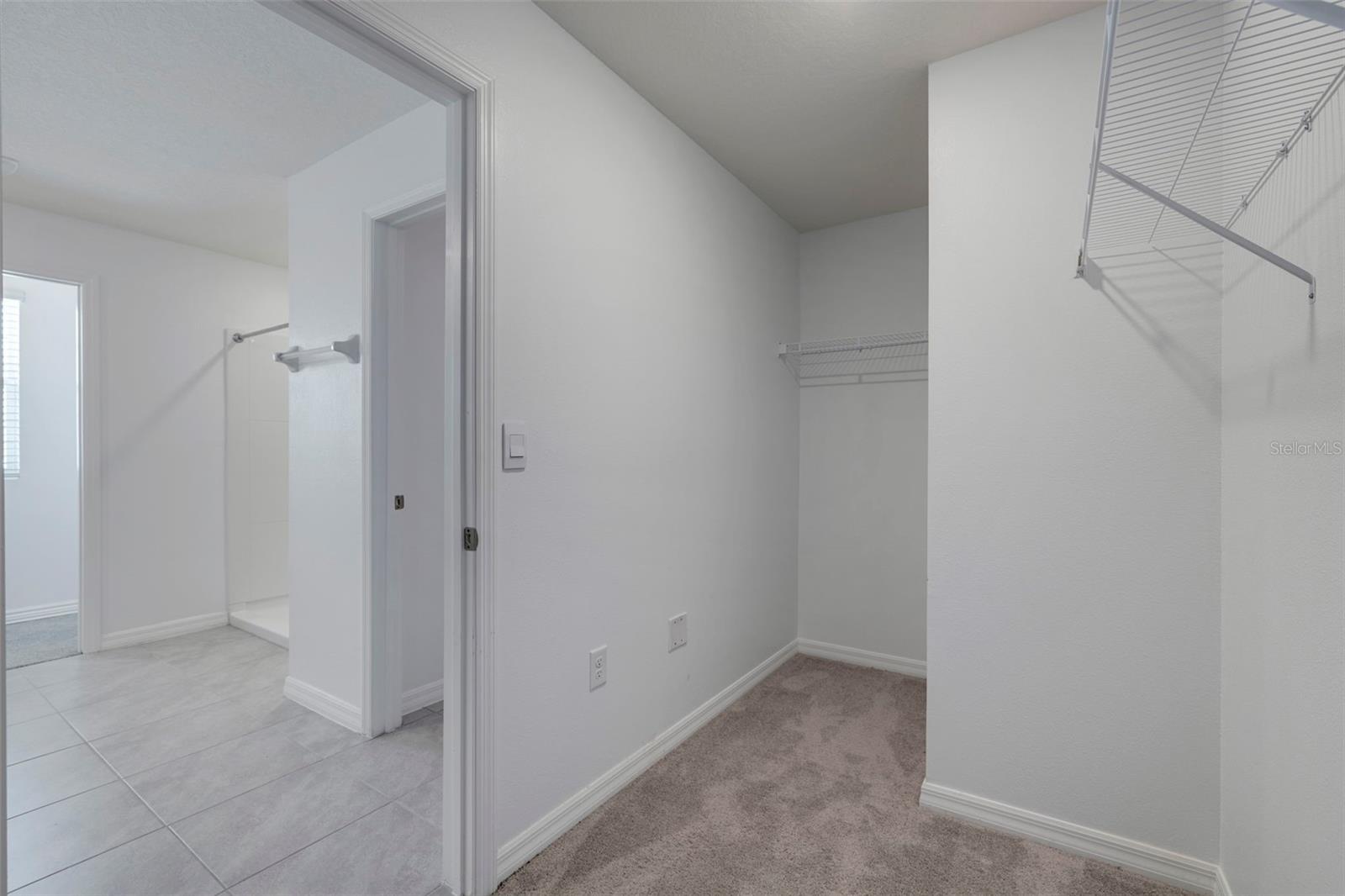 Primary bath with double walk in closets