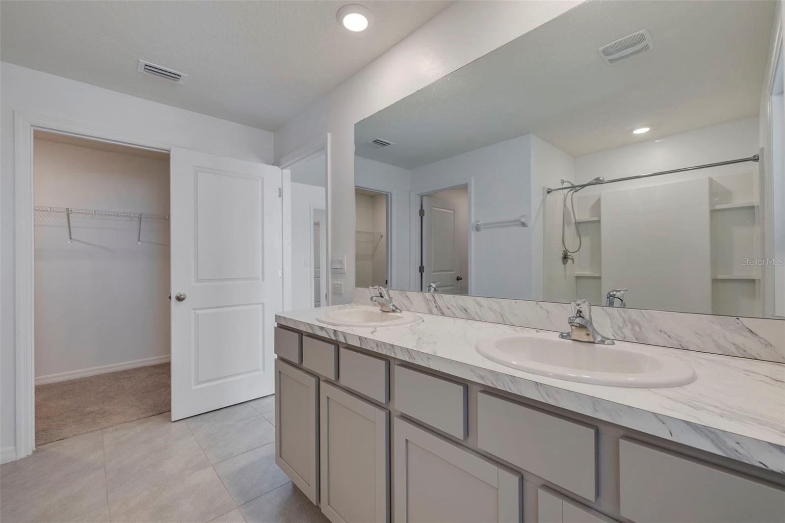 Primary Bath with dual vanities and dual closets