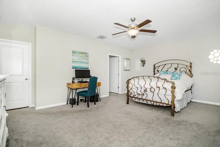 The master suite is also located on the first floor and is a true haven of tranquility, featuring a generously sized walk-in closet and an en-suite bathroom.