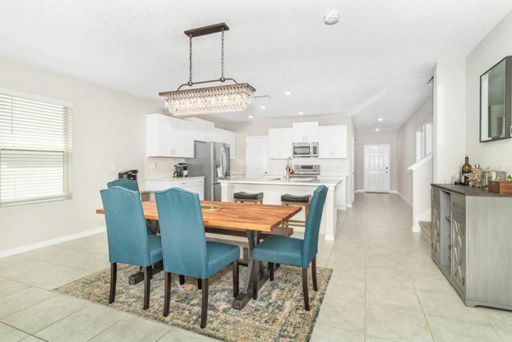 The open-concept design seamlessly flows into the dining area/ large family room combo providing an ideal setting for gatherings and relaxation.