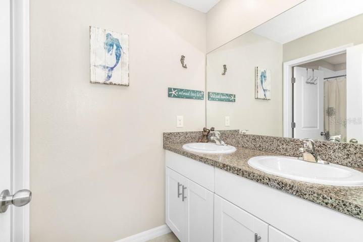 The full bathroom with tub and shower on this level ensures convenience for family and guests.
