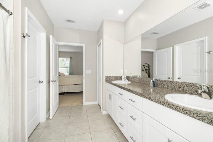 Master Bedroom's en-suite bathroom with a dual vanity and a step-in shower.