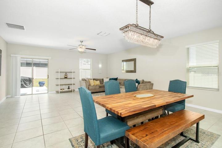 The open-concept design seamlessly flows into the dining area/ large family room combo providing an ideal setting for gatherings and relaxation.