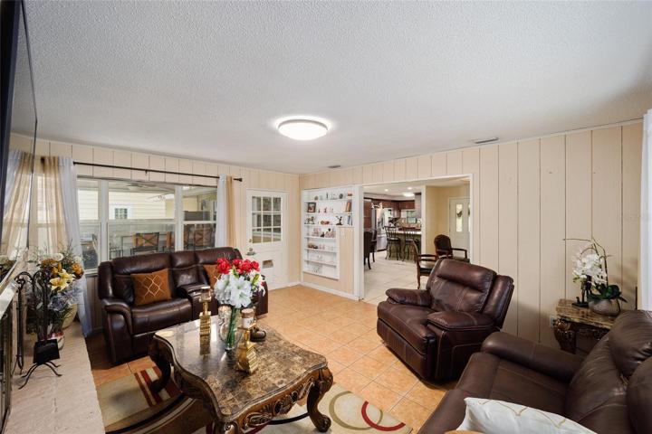 Fireplace room leading out to pool area
