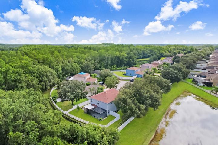 The lot sits on a cul-de-sac on a corner lot, with only one neighbor and surrounded by lush conservation.