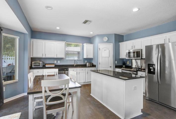 The kitchen has an adjacent breakfast nook area, making it very functional