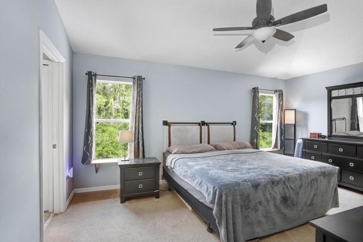 The master bedroom upstairs is spacious and provides plenty of natural light.