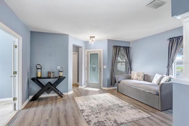 Adjacent is a beautiful bedroom with French doors.