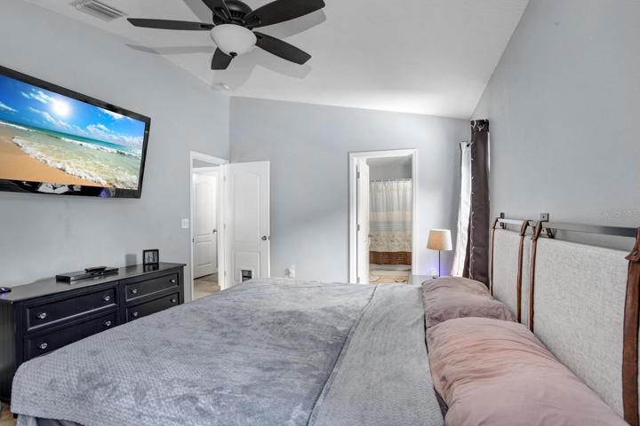 The master bedroom upstairs is spacious and provides plenty of natural light.