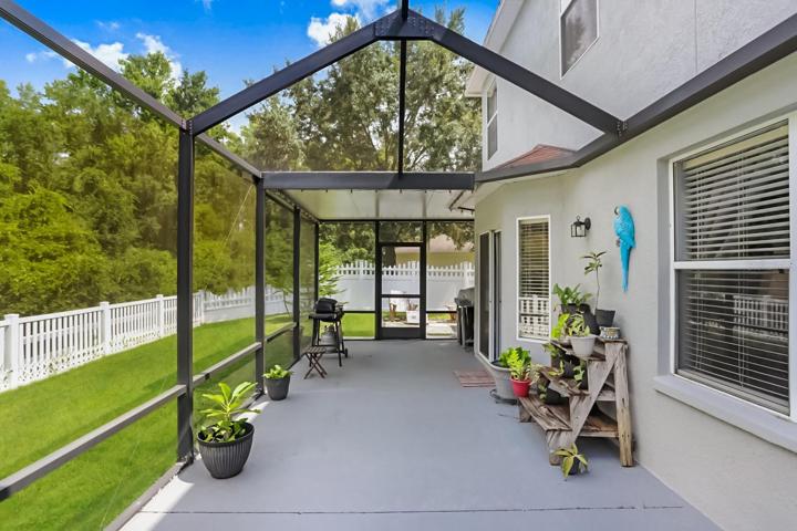 The extended & fully enclosed lanai provides privacy and beautiful conservation views.