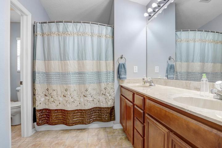 The master bath has a dual vanity, tub/shower combo and a private water closet.