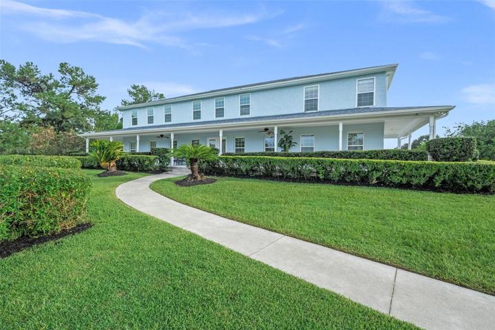 Grand estate with immaculate landscaping.