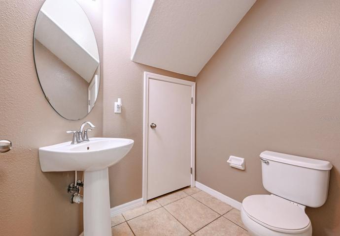Downstairs Half Bath Under Stairs
