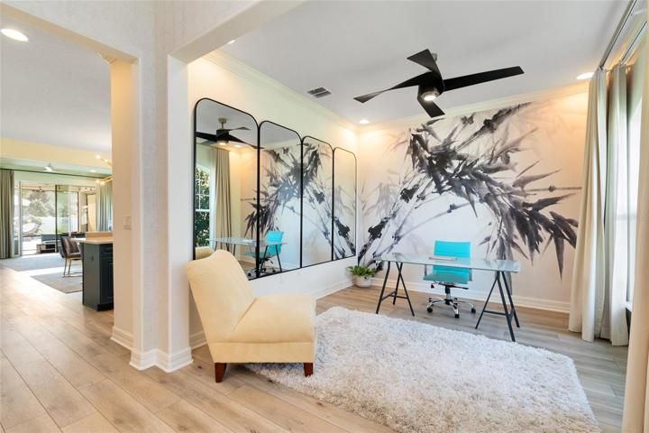 As you step inside the foyer, you'll immediately notice the beautiful new engineered hardwood floors that lead you to a versatile flex space on your right.