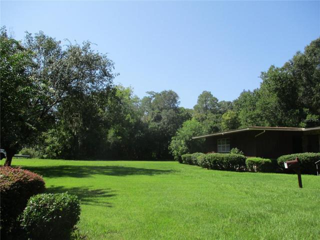Bordered on three sides by creeks or conservation area